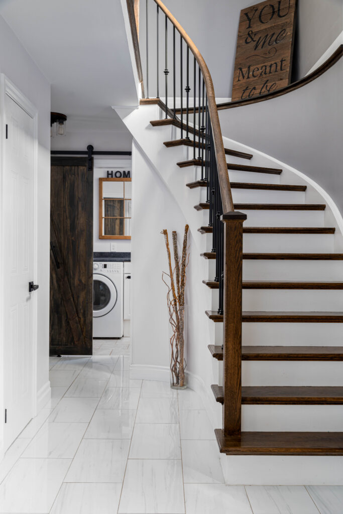 White staircase with rich wooden steps