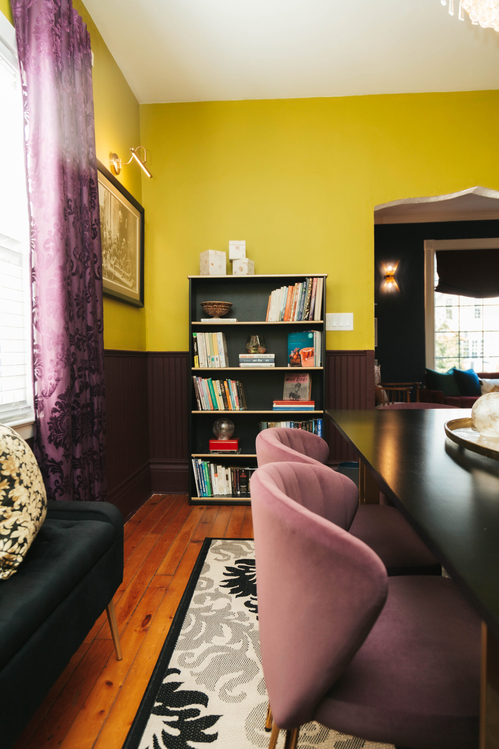 Dining room with cozy interior and book shelf